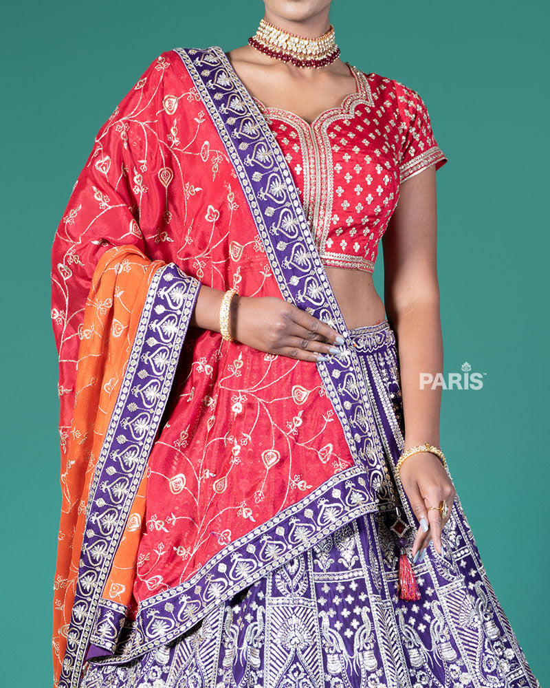 Vibrant Purple Lehenga Crimson Red Choli with Silver Embroidery and Red-Orange Dupatta