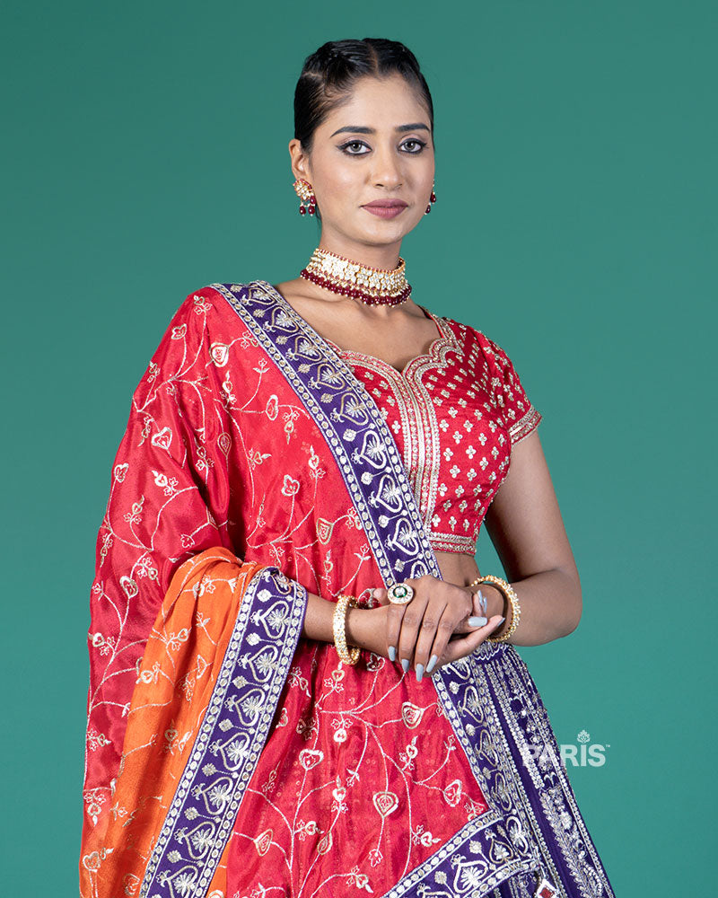 Vibrant Purple Lehenga Crimson Red Choli with Silver Embroidery and Red-Orange Dupatta