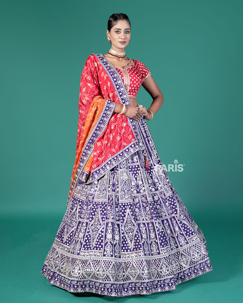 Vibrant Purple Lehenga Crimson Red Choli with Silver Embroidery and Red-Orange Dupatta