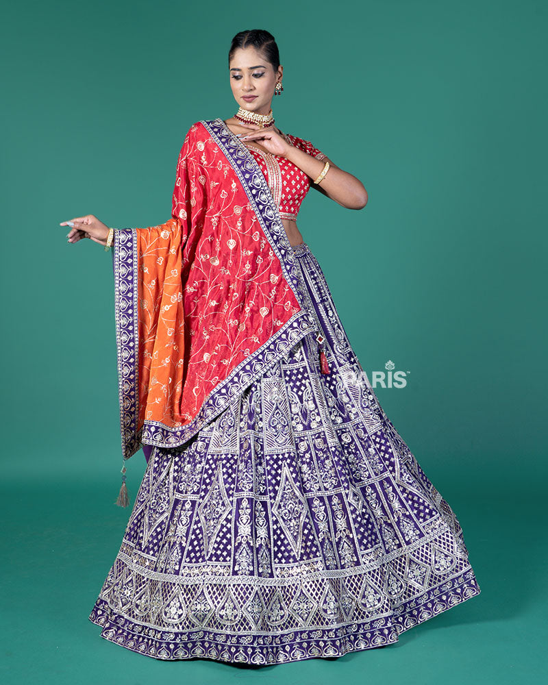 Vibrant Purple Lehenga Crimson Red Choli with Silver Embroidery and Red-Orange Dupatta