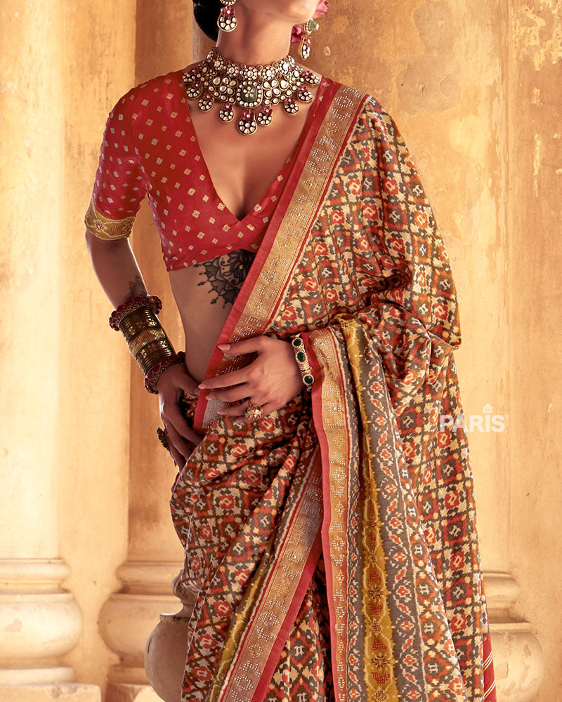 Beige Patola Silk Saree – Orange Zari Border, Classic Festive Look