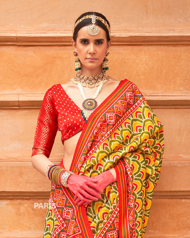 Blue Silk Patola Saree with Pink Zari Border