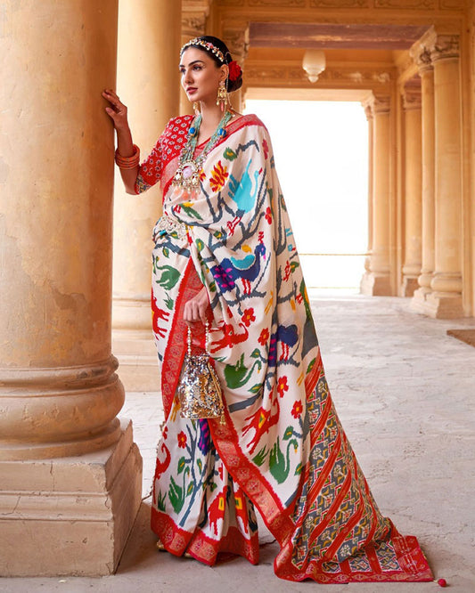 White Pure Patola Print Saree with Contrast Border And Unstitched Blouse