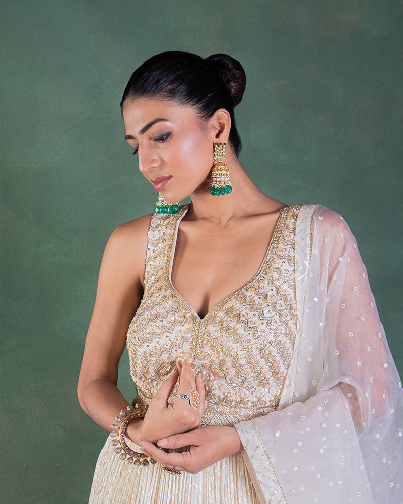 Green silk lehenga with off shoulder blouse and dupatta