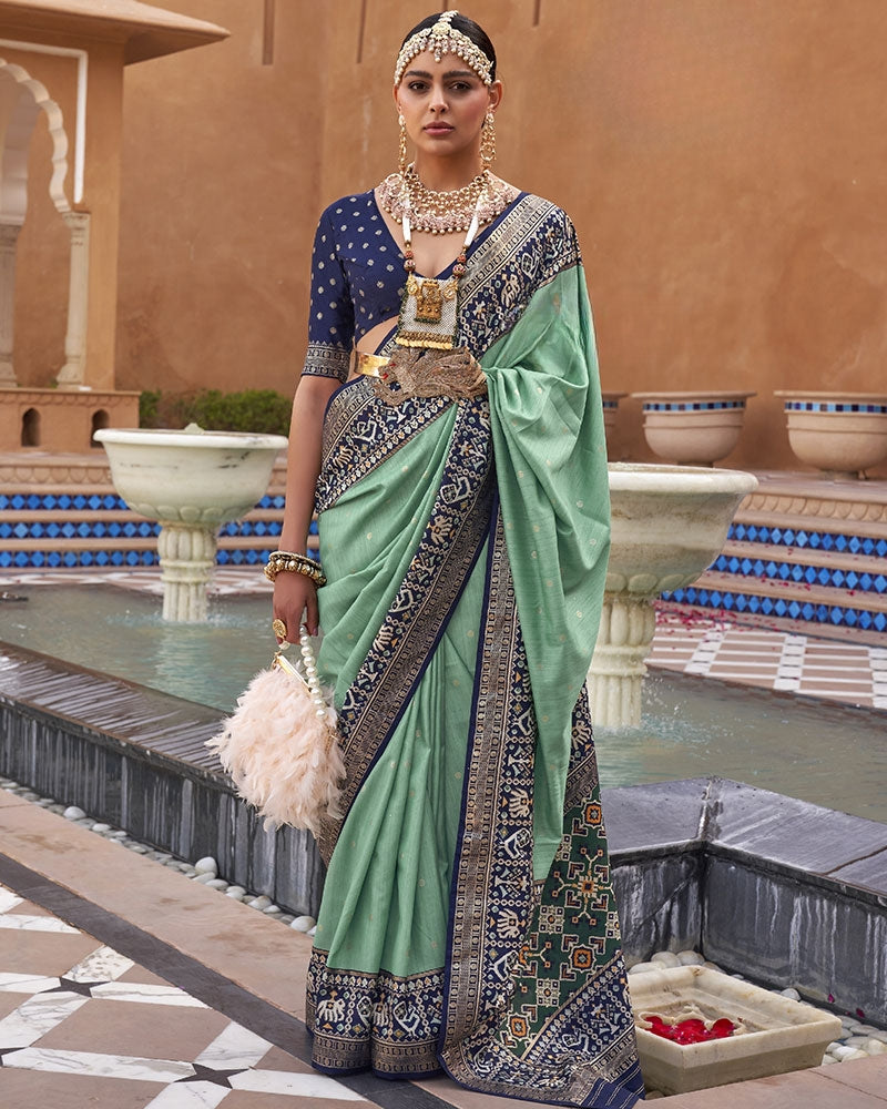 Sage green Printed Patola Silk Saree with blue border and  Blouse Piece