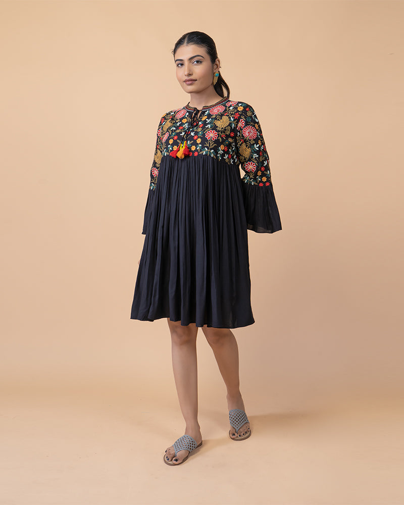 Chic Knee-Length Dress with Intricate Embroidery and flared Long Sleeves