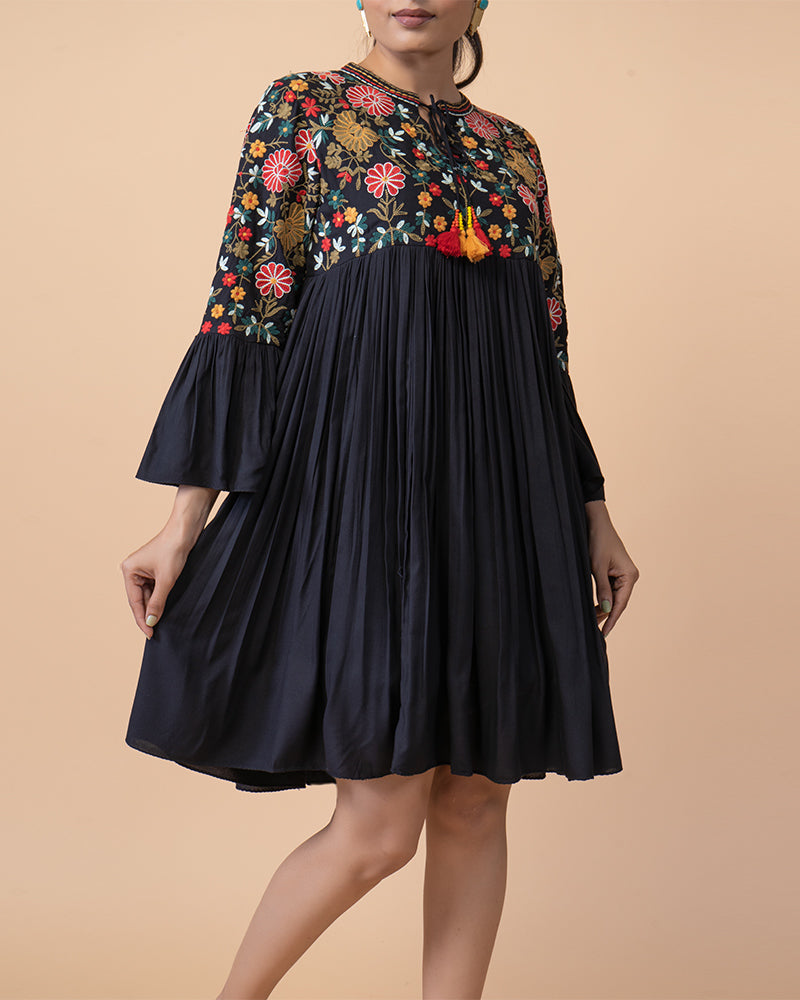 Chic Knee-Length Dress with Intricate Embroidery and flared Long Sleeves