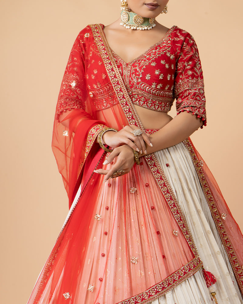 Cream Lehenga with Golden Embroidery, Heavy Red Choli, and Draped Net Dupatta