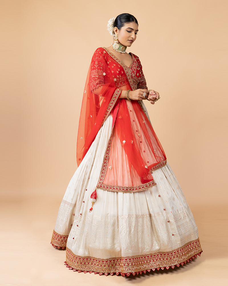 Cream Lehenga with Golden Embroidery, Heavy Red Choli, and Draped Net Dupatta