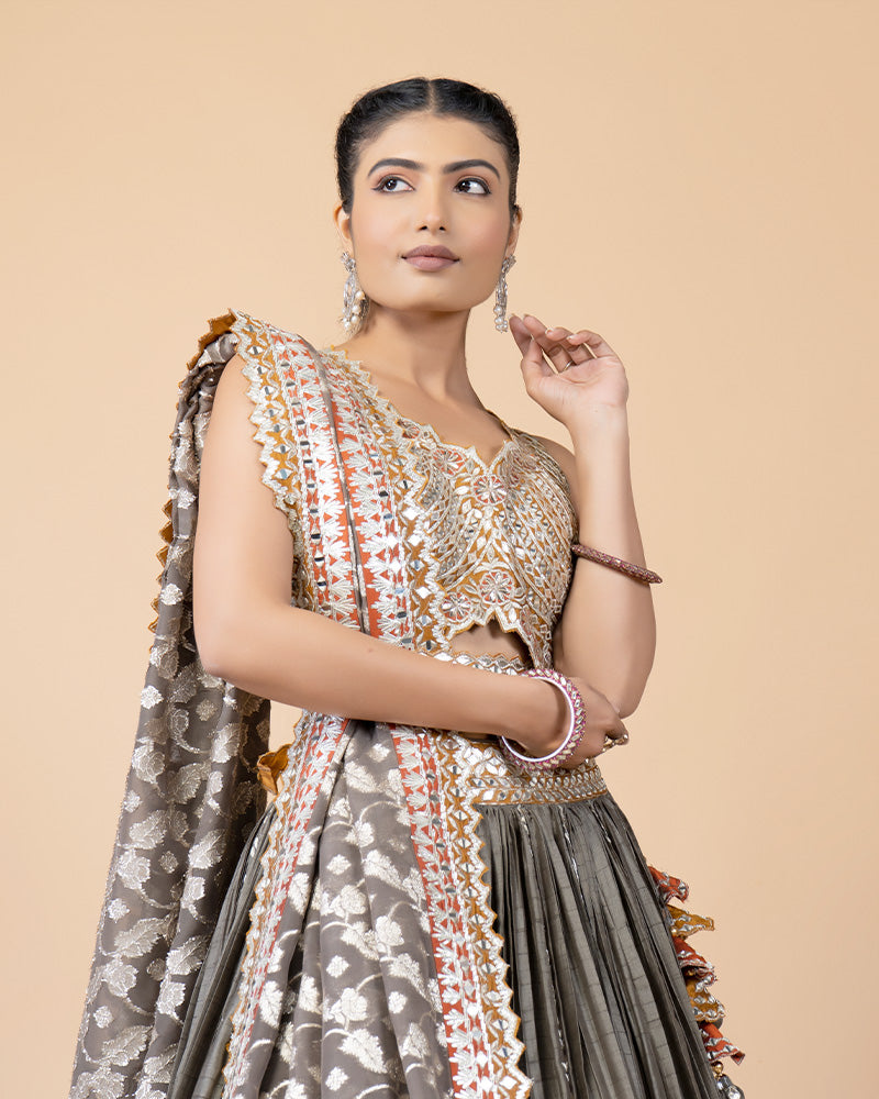 Grey Lehenga with Contrast Orange Hand Embellished Choli and Silk Dupatta