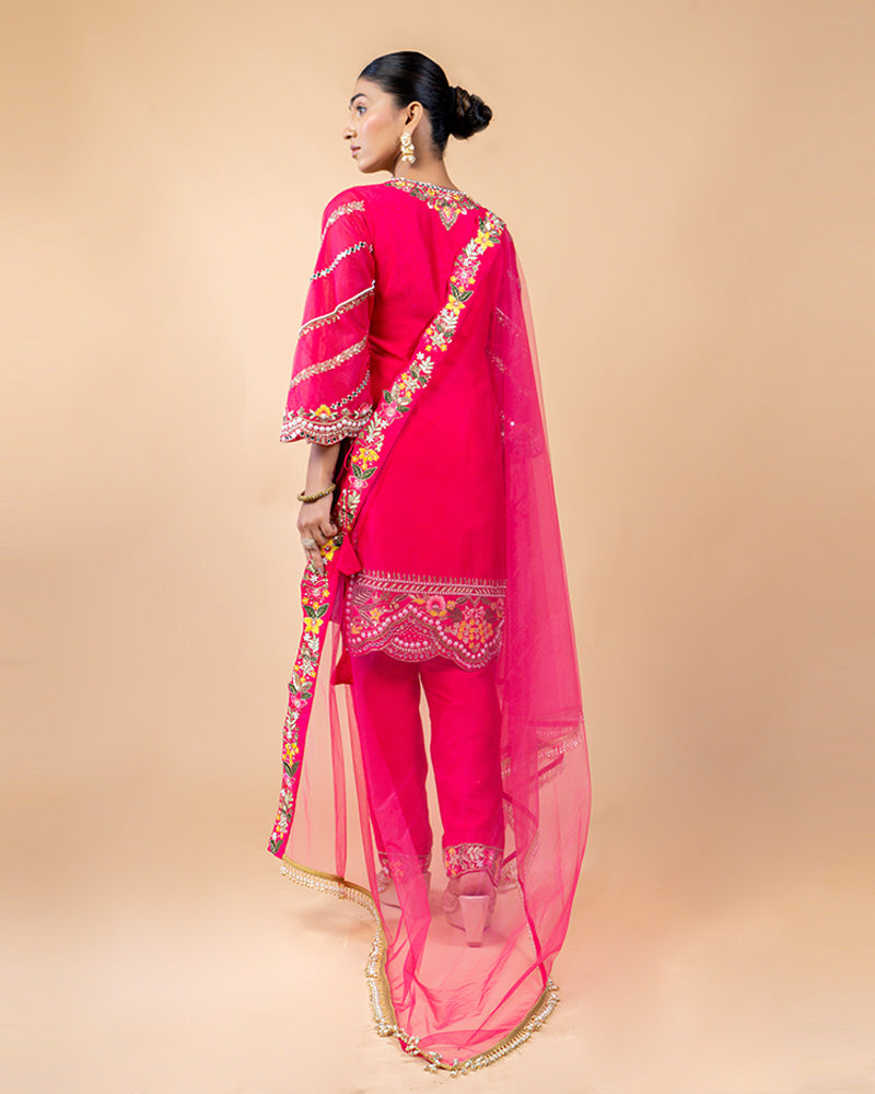 Hot Pink Straight Cut Salwar Kameez with Net Dupatta and Tassels at Border