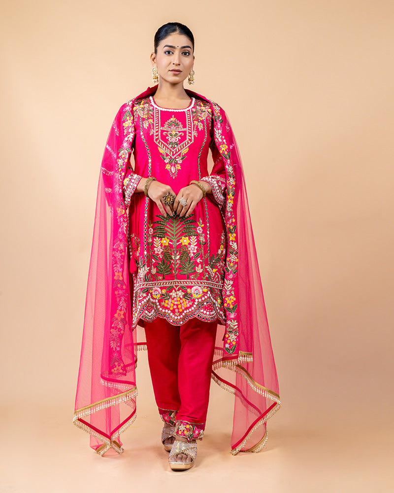 Hot Pink Straight Cut Salwar Kameez with Net Dupatta and Tassels at Border