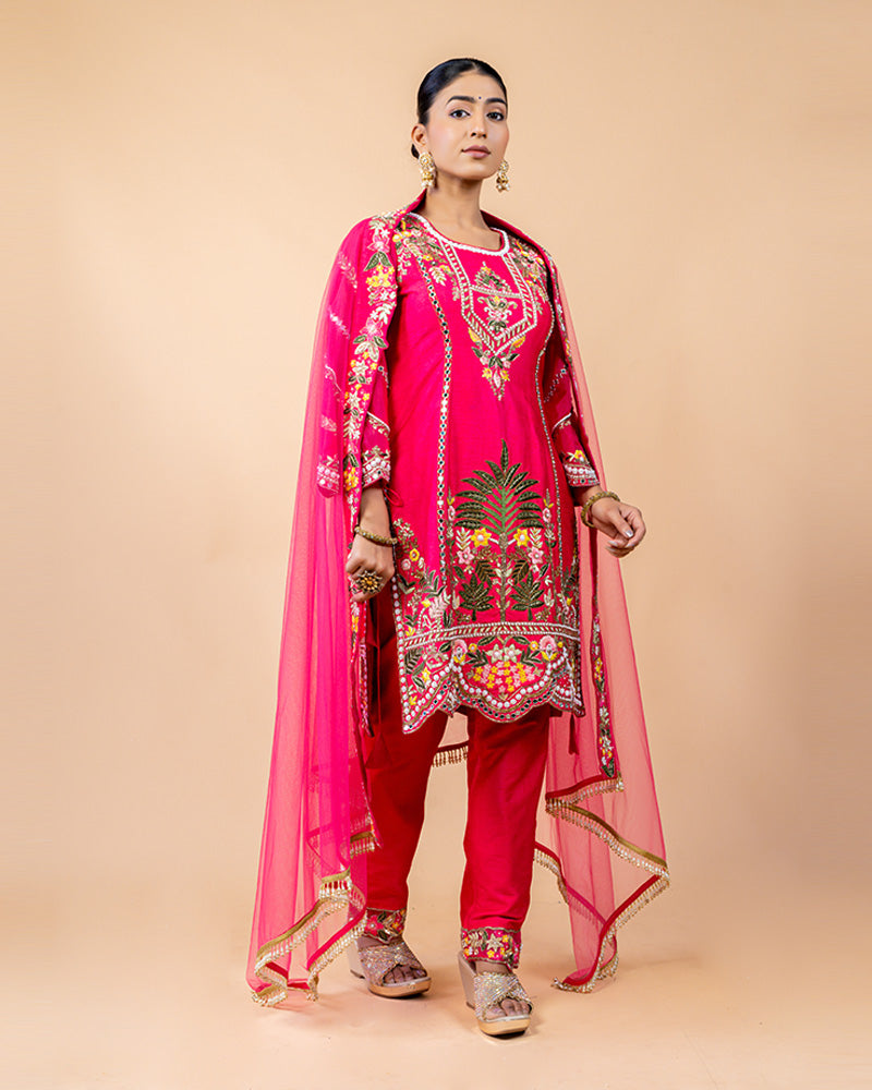 Hot Pink Straight Cut Salwar Kameez with Net Dupatta and Tassels at Border