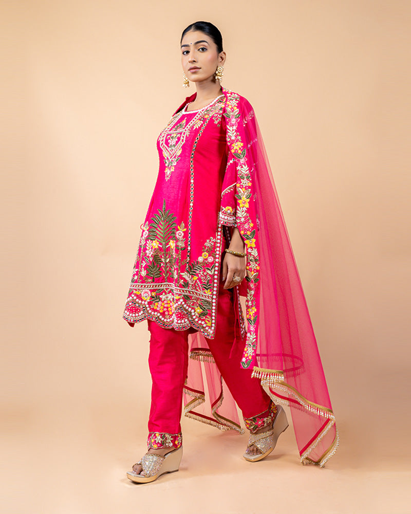 Hot Pink Straight Cut Salwar Kameez with Net Dupatta and Tassels at Border