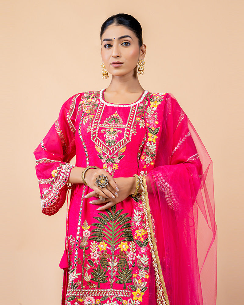 Hot Pink Straight Cut Salwar Kameez with Net Dupatta and Tassels at Border