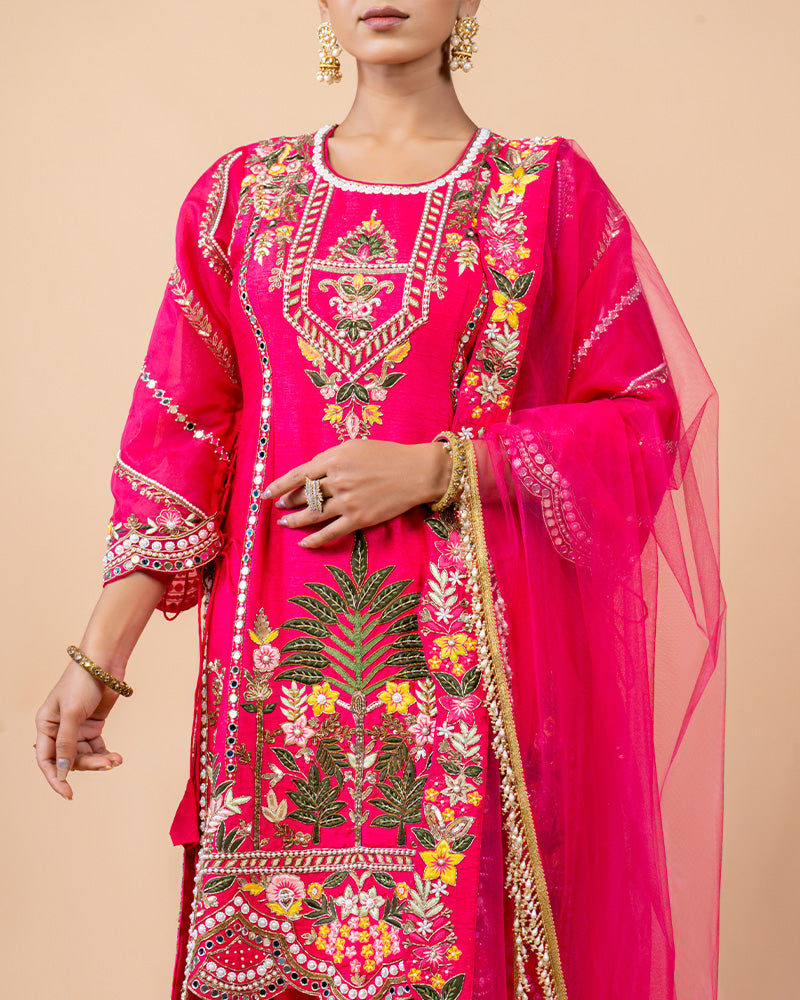 Hot Pink Straight Cut Salwar Kameez with Net Dupatta and Tassels at Border