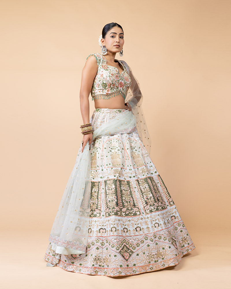 Light Pista Lehenga Choli Embellished with Hand Work and Sequence Heavy Work Border with Net Dupatta