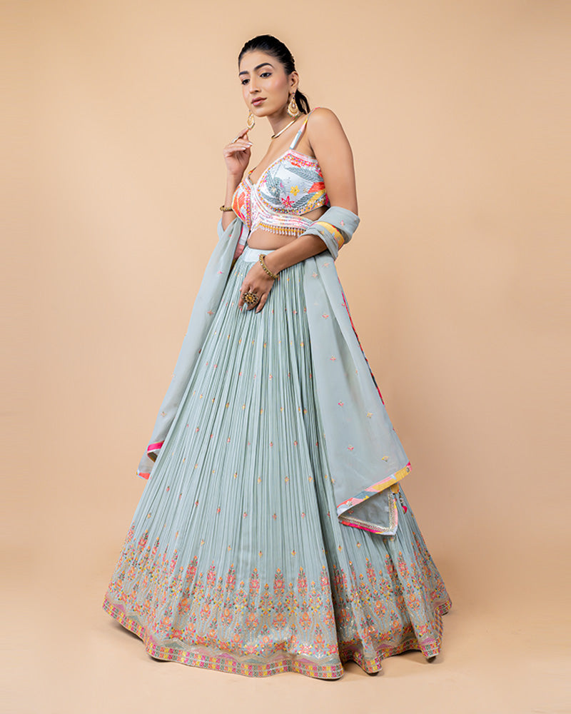 Light Turquoise Lehenga Choli with Sleeveless Choli and Net Dupatta