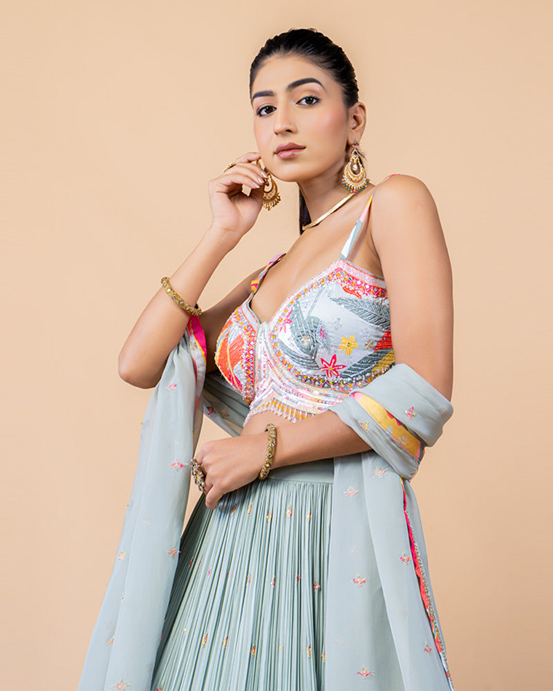 Light Turquoise Lehenga Choli with Sleeveless Choli and Net Dupatta