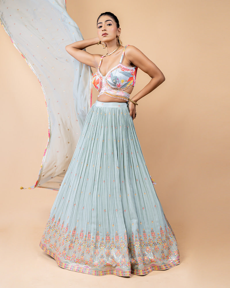 Light Turquoise Lehenga Choli with Sleeveless Choli and Net Dupatta