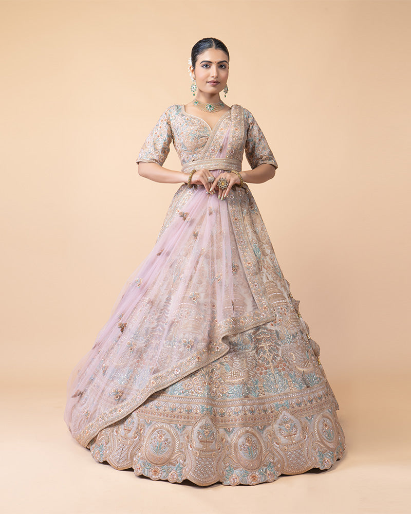 Ornate Lehenga Choli with Intricate Embroidery and Sequin Details with Contrast Pink Net Dupatta