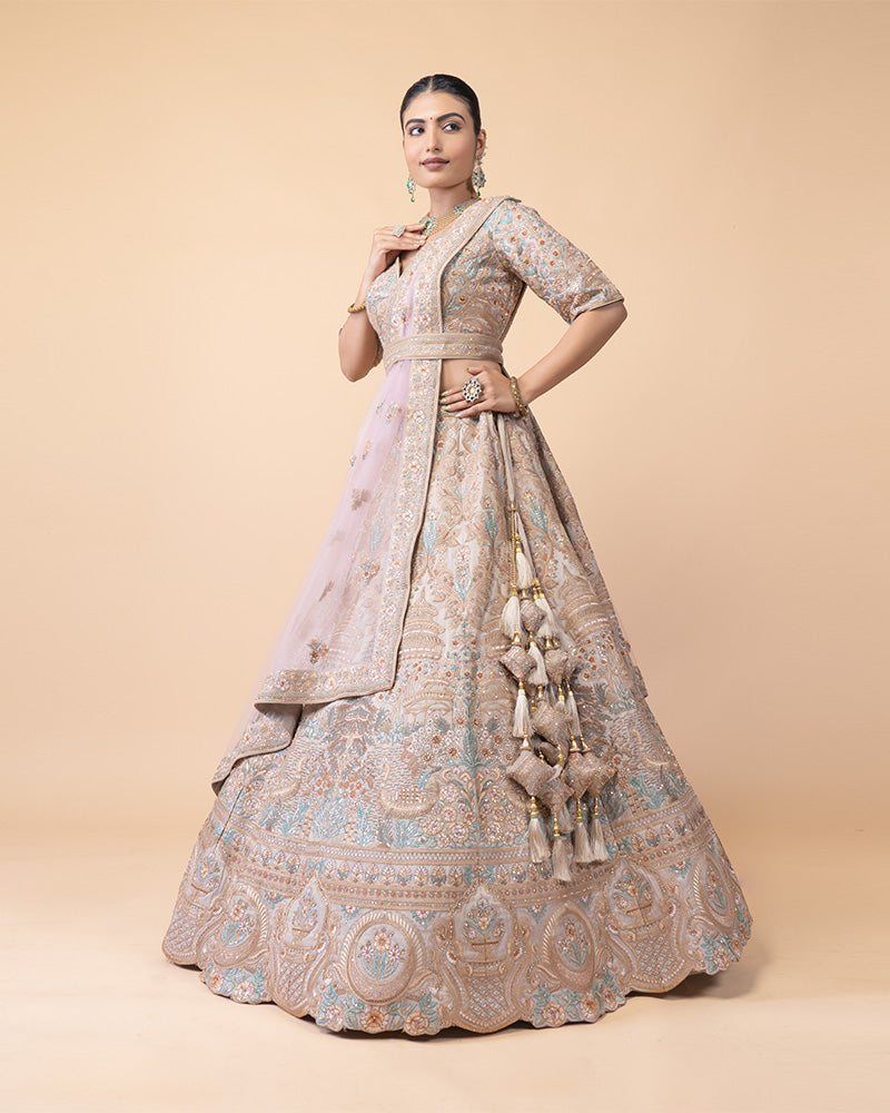 Ornate Lehenga Choli with Intricate Embroidery and Sequin Details with Contrast Pink Net Dupatta