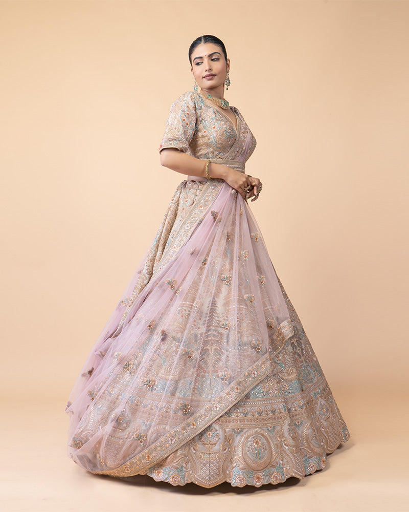 Ornate Lehenga Choli with Intricate Embroidery and Sequin Details with Contrast Pink Net Dupatta