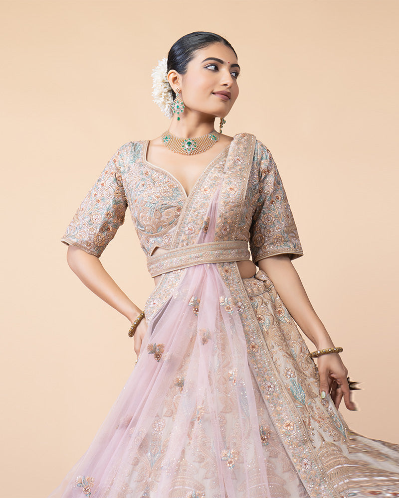 Ornate Lehenga Choli with Intricate Embroidery and Sequin Details with Contrast Pink Net Dupatta