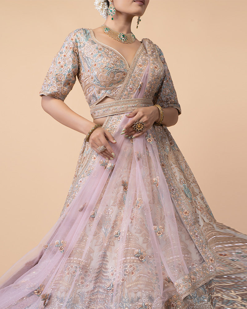 Ornate Lehenga Choli with Intricate Embroidery and Sequin Details with Contrast Pink Net Dupatta